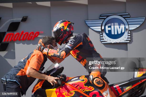 Pol Espargaro of Spain and Red Bull KTM Factory Racing celebrates pole position with mechanic the MotoGP at the end of the qualifying practice during...