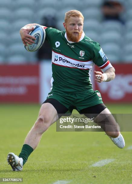 Tom Homer of London Irish runs with the ball during the Gallagher Premiership Rugby match between London Irish and Northampton Saints at Twickenham...