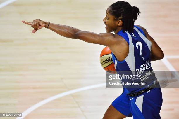 Crystal Dangerfield of the Minnesota Lynx points during the second half of a game against the Phoenix Mercury at Feld Entertainment Center on August...