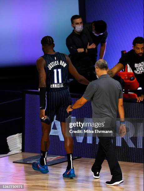 James Ennis III of the Orlando Magic leaves the court after being ejected along with Marvin Williams of the Milwaukee Bucks in Game Three of the...