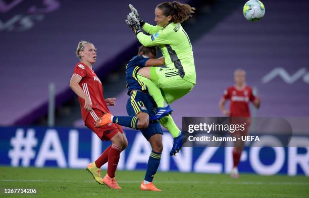 Nikita Parris of Olympique Lyon collides with Laura Benkarth of FC Bayern Munich as she scores her team's first goal during the UEFA Women's...
