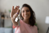 Female tenant show keys moving to new home