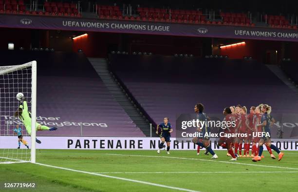 Laura Benkarth of FC Bayern Munich fails to save as Amel Majri of Olympique Lyon scores her team's second goal during the UEFA Women's Champions...