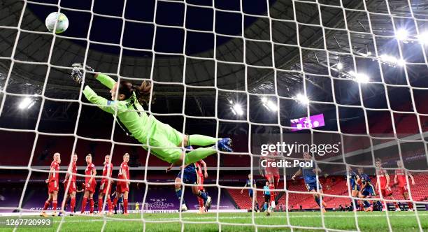 Laura Benkarth of FC Bayern Munich fails to save as Amel Majri of Olympique Lyon scores her team's second goal during the UEFA Women's Champions...