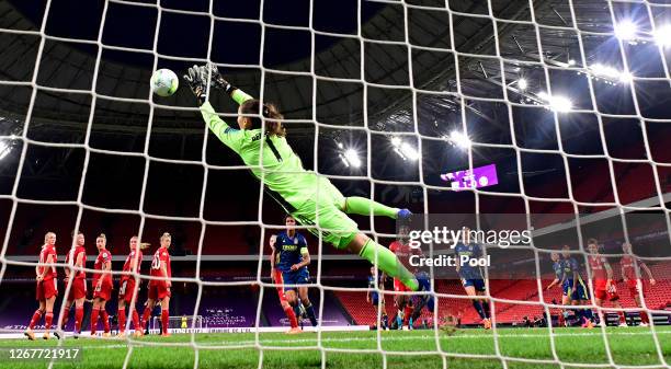 Laura Benkarth of FC Bayern Munich fails to save as Amel Majri of Olympique Lyon scores her team's second goal during the UEFA Women's Champions...