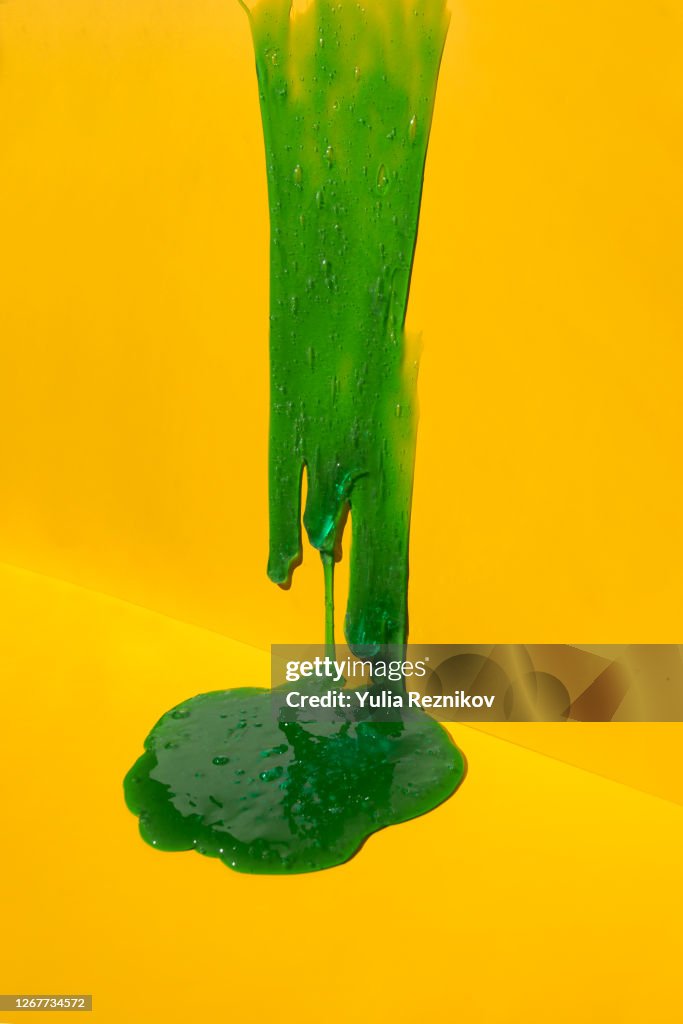 Flowing blue soap on the yellow background