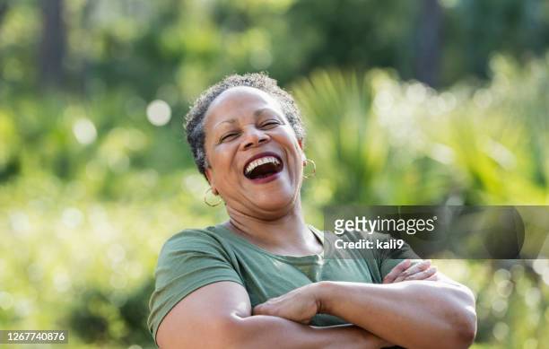 senior african-american woman at a park - voluptuous stock pictures, royalty-free photos & images