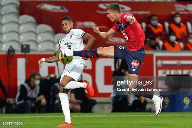 Raphinha of Rennes fights for the ball with Sven Botman of Lille during the Ligue 1 match between Lille OSC and Stade Rennes at Stade Pierre Mauroy...