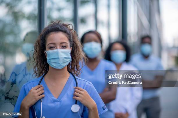 group of doctors outside - healthcare worker in mask stock pictures, royalty-free photos & images