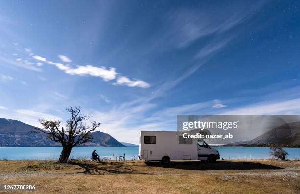 camping under stars. - caravan new zealand stock pictures, royalty-free photos & images