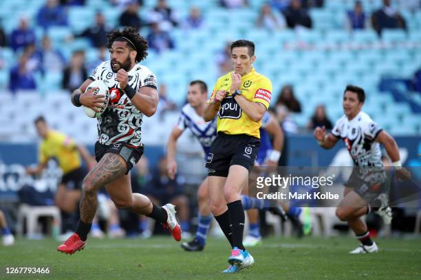 Adam Blair of the Warriors runs in to referee Peter Gough during the round 15 NRL match between the Canterbury Bulldogs and the New Zealand Warriors...