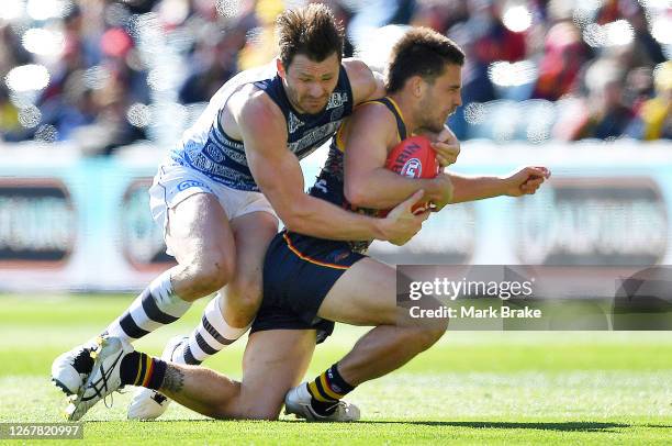 Patrick Dangerfield of the Cats tackles Lachlan Murphy of the Crows high during the round 13 AFL match between the Adelaide Crows and the Geelong...