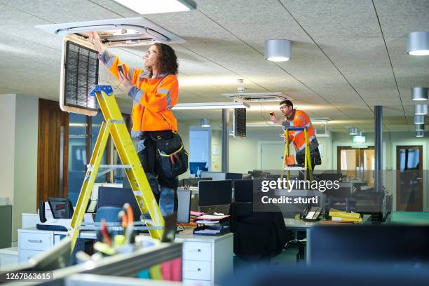 office aircon servicing - air duct repair stock pictures, royalty-free photos & images