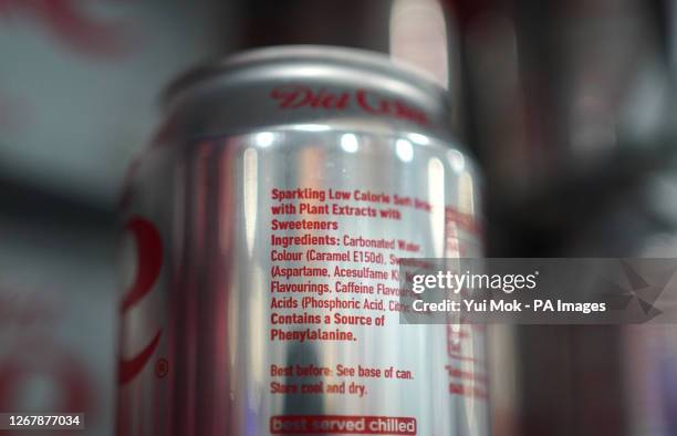 Cans of Diet Coke in a supermarket, as an artificial sweetener commonly used in thousands of products including diet fizzy drinks, ice cream and...
