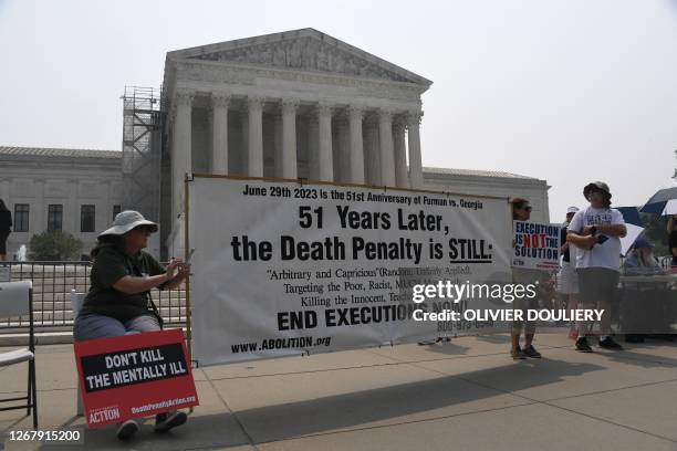 Death penalty protesters demonstrate outside the US Supreme Court in Washington, DC, on June 29, 2023.