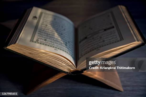 the quran, religious text of islam. - koran stock pictures, royalty-free photos & images