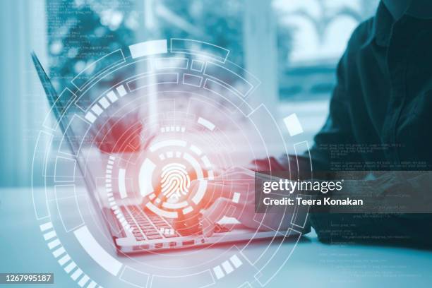 finger print icon pressed with finger, cyber security, information privacy - digital piracy stock pictures, royalty-free photos & images
