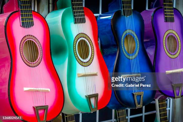 four colorful guitars - melody perez stockfoto's en -beelden