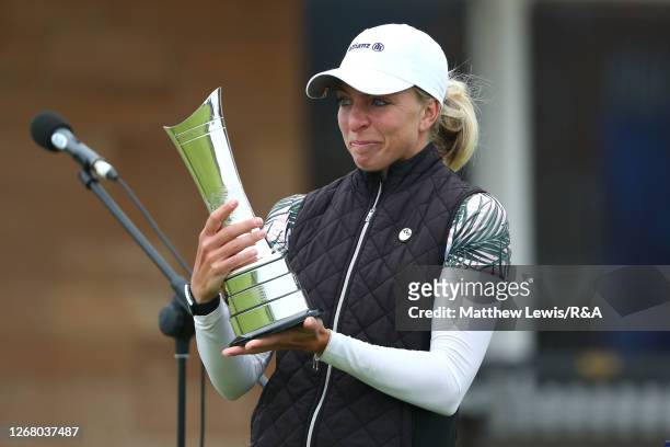 Sophia Popov of Germany lifts the trophy following victory in the final round during Day Four of the 2020 AIG Women's Open at Royal Troon on August...