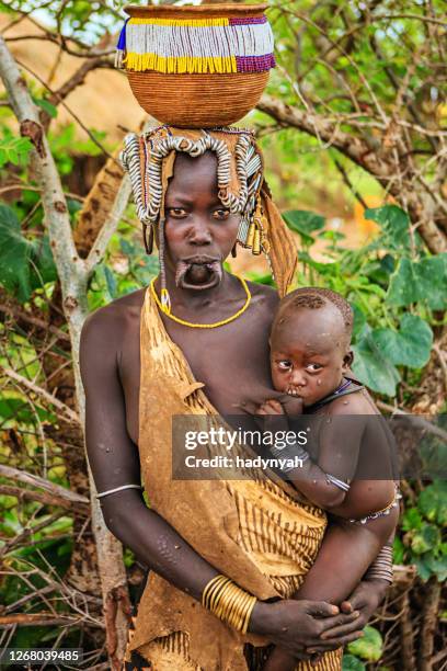 portrait of woman from mursi tribe, ethiopia, africa - mursi tribe they stock pictures, royalty-free photos & images