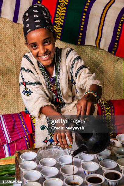 young african girl preparing coffee, ethiopia. east africa - ethiopian coffee ceremony imagens e fotografias de stock