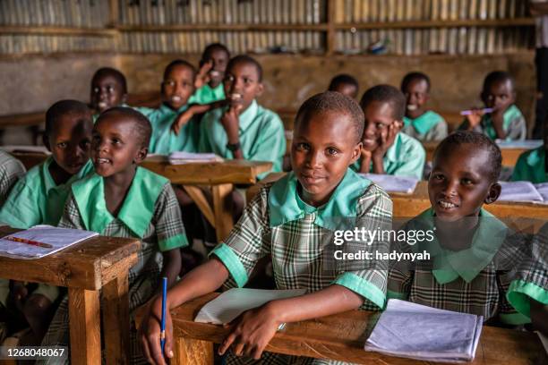 school children in a school near masai mara game reserve in kenya - africa school stock pictures, royalty-free photos & images