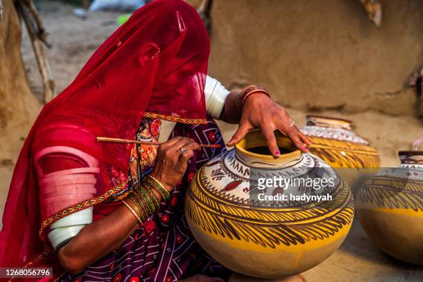 indian woman painting vases in her workshop, rajasthan, india - craft stock pictures, royalty-free photos & images