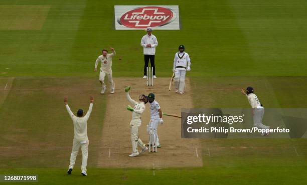 Dom Bess and Jos Buttler of England celebrate after the dismissal of Fawad Alam of Pakistan during the third Test match between England and Pakistan...