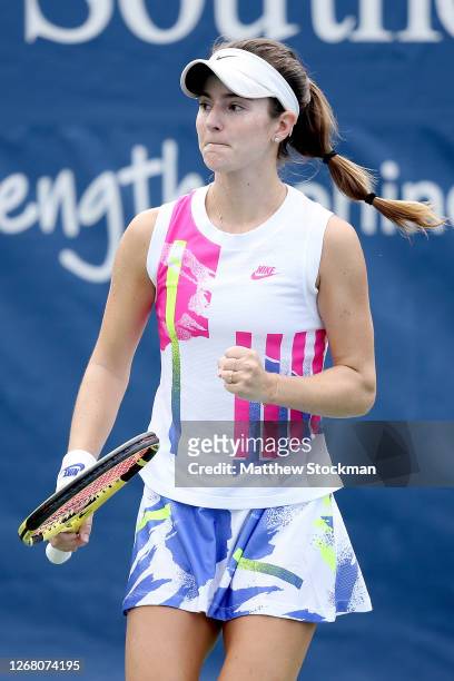 Catherine Bellis celebrates a point against Oceane Dodin of France during the Western & Southern Open at the USTA Billie Jean King National Tennis...