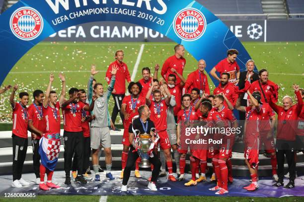 Hans-Dieter Flick, Head Coach of FC Bayern Munich celebrates with the UEFA Champions League Trophy following his team's victory in the UEFA Champions...