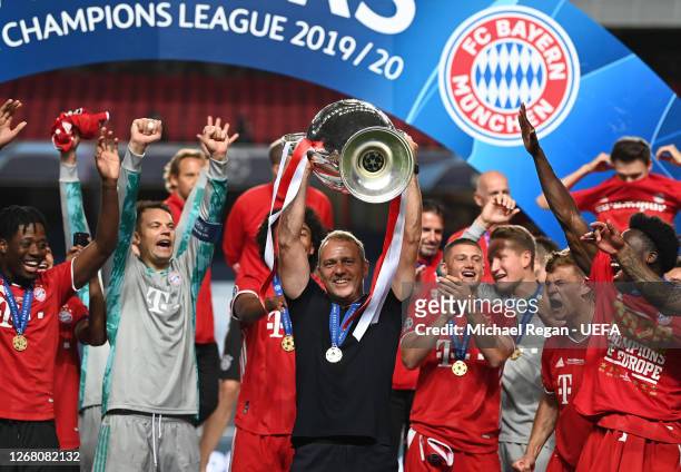 Hans-Dieter Flick, Head Coach of FC Bayern Munich lifts the UEFA Champions League Trophy following his team's victory in the UEFA Champions League...