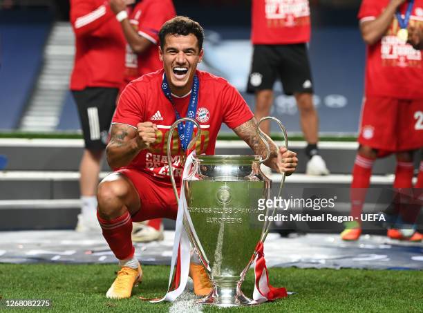 Philippe Coutinho of FC Bayern Munich celebrates with the UEFA Champions League Trophy following his team's victory in the UEFA Champions League...