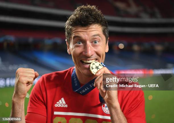 Robert Lewandowski of FC Bayern Munich celebrates with his UEFA Champions League winners medal following his team's victory in the UEFA Champions...