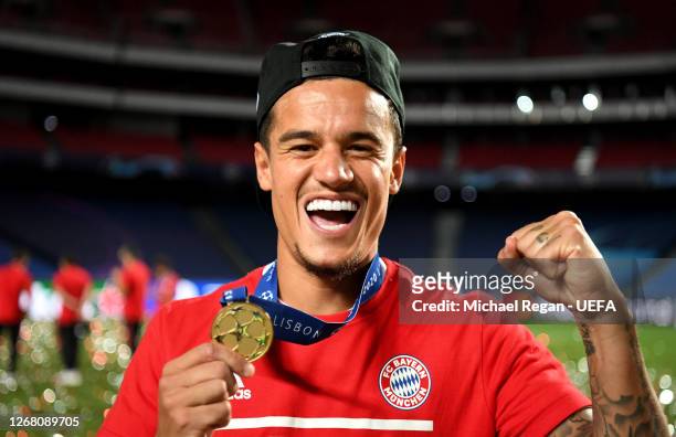 Philippe Coutinho of FC Bayern Munich celebrates with his winners medal following victory in the UEFA Champions League Final match between Paris...