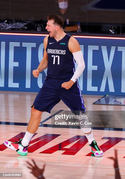 Luka Doncic of the Dallas Mavericks celebrates a game winning three point basket against the LA Clippers during overtime in Game Four of the Western...