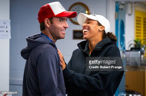 Madison Keys of the United States talks to fiance Bjorn Fratangelo during a rain interruption in the quarter-final on Day Six of the Rothesay...