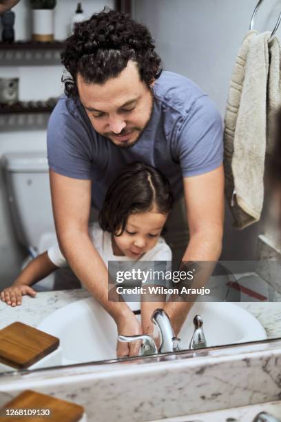 dad washing kids hands - famly house stock pictures, royalty-free photos & images