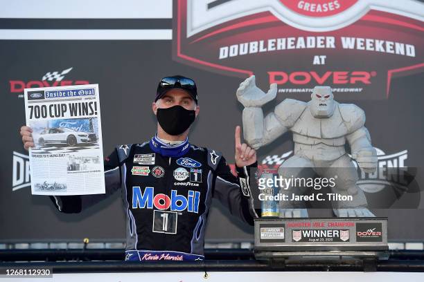 Kevin Harvick, driver of the Mobil 1 Ford, celebrates in Victory Lane after winning the NASCAR Cup Series Drydene 311 at Dover International Speedway...