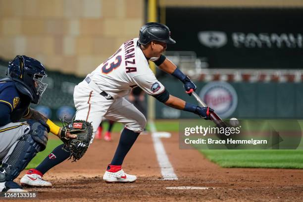 Ehire Adrianza of the Minnesota Twins bunts against the Milwaukee Brewers on August 18, 2020 at Target Field in Minneapolis, Minnesota.