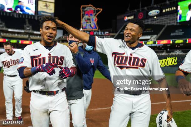 Jorge Polanco of the Minnesota Twins celebrates with Jorge Alcala against the Milwaukee Brewers on August 18, 2020 at Target Field in Minneapolis,...