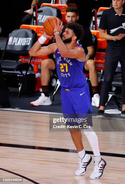 Jamal Murray of the Denver Nuggets shoots a three point basket against the Utah Jazz during the fourth quarter in Game Four of the Western Conference...