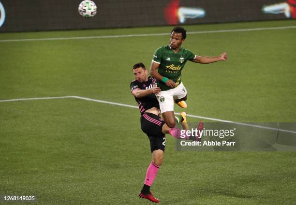 Jeremy Ebobisse of Portland Timbers leaps for the ball against Shane O'Neill of Seattle Sounders in the second half at Providence Park on August 23,...