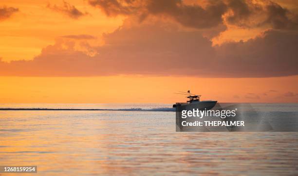 fishing boat speeding key largo florida - gulf coast states stock pictures, royalty-free photos & images