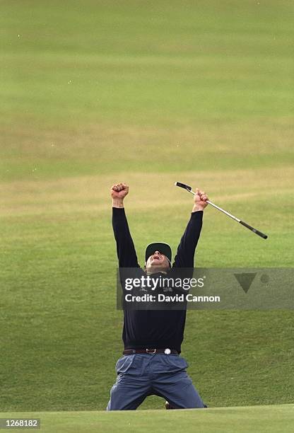 Costantino Rocca of Italy celebrates after holing a birdie putt on the 18th to force a play-off during the British Open at St Andrews Golf Club in...