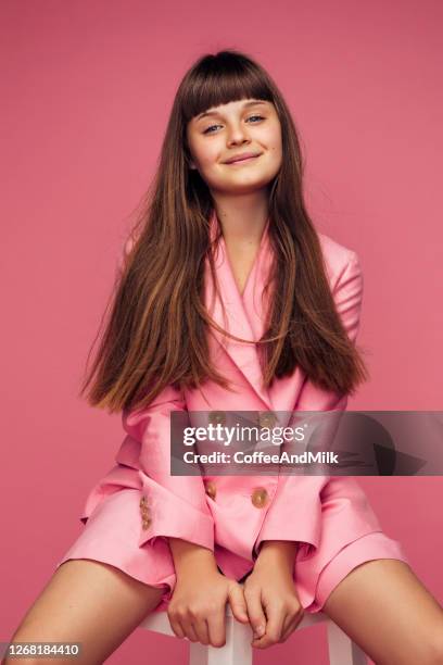 photo of young girl with long hair - pink blazer stock pictures, royalty-free photos & images