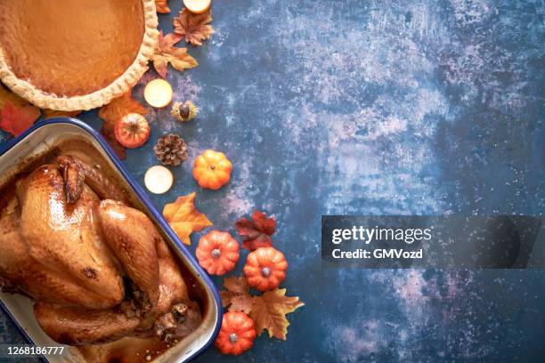 traditional holiday stuffed turkey on rustic background - thanksgiving 2020 stock pictures, royalty-free photos & images