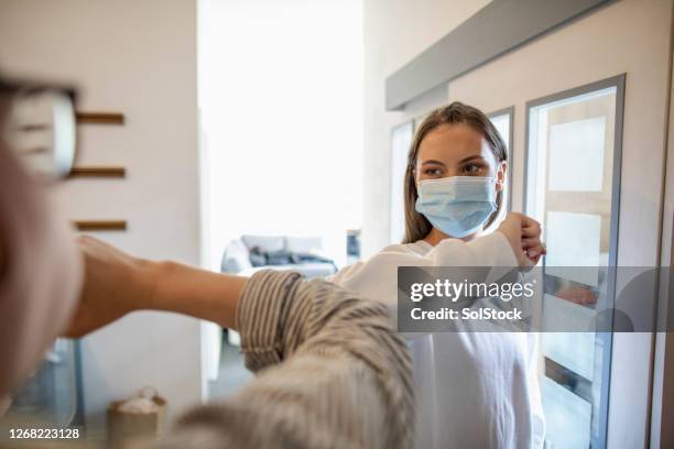work colleague greeting - business people elbow bumping stock pictures, royalty-free photos & images