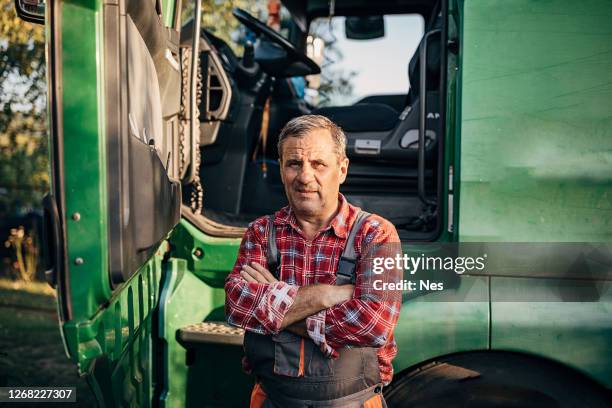 portrait of a senior truck driver - truck driver stock pictures, royalty-free photos & images