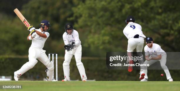 Max Holden of Middlesex bats as Ben Brown, Delray Rawlins and Phil Salt of Sussex fields during Day Three of the Bob Willis Trophy match between...