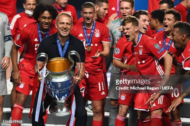 Bayern head Coach Hans-Dieter Flick lifts the European Cup after the UEFA Champions League final football match between Paris Saint-Germain and...